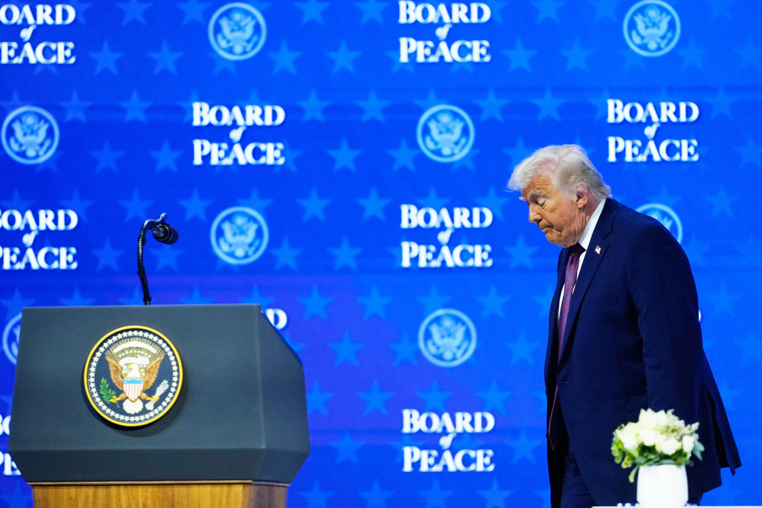 President Donald J. Trump walks on the podium after a signing ceremony of his Board of Peace initiative at the Annual Meeting of the World Economic Forum in Davos, Switzerland, January 22. (AP Photo/Markus Schreiber)