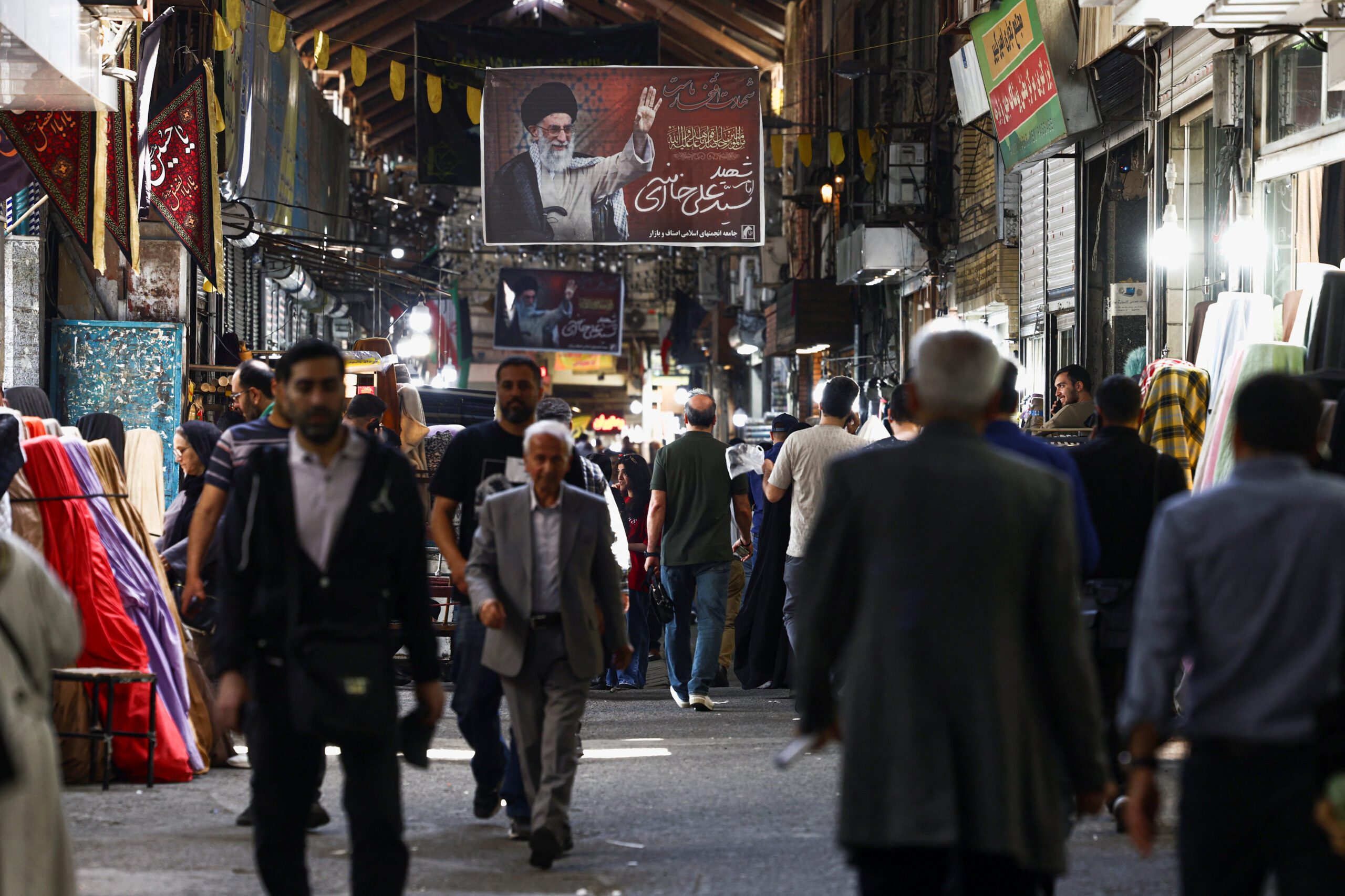 A banner bearing a picture of the late supreme leader of Iran, Ayatollah Ali Khamenei, is displayed in Tehran Bazaar, amid a cease-fire between United States and Iran, in Tehran, Iran, April 21. (Majid Asgaripour/West Asia News Agency via REUTERS)