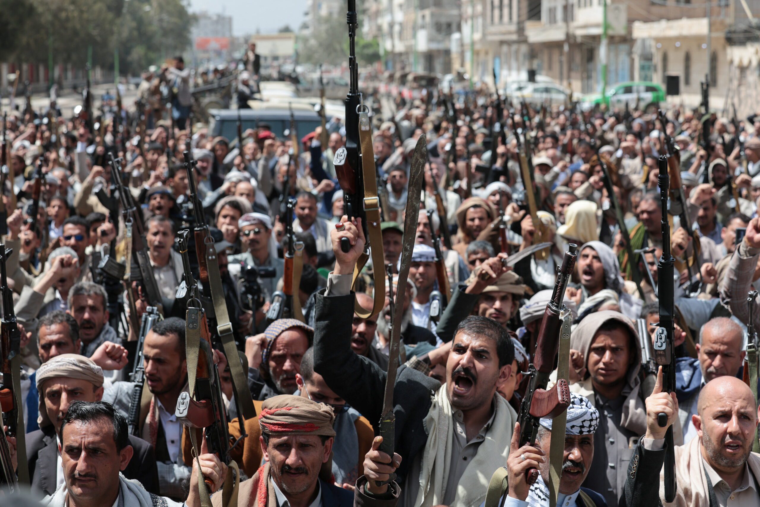 Houthi followers hold weapons during a pro-Iran demonstration in Sanaa, Yemen, April 6. (REUTERS/Khaled Abdullah)