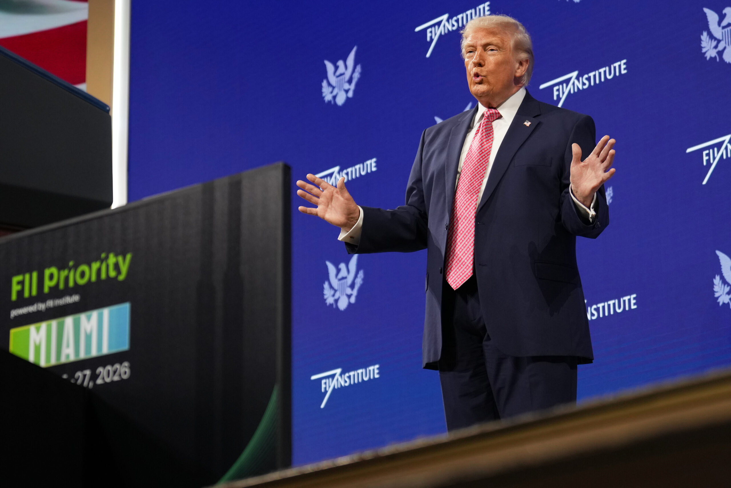 President Donald J. Trump takes the stage at the Future Investment Initiative Institute's summit, March 27, in Miami Beach, Florida. (AP Photo/Mark Schiefelbein)