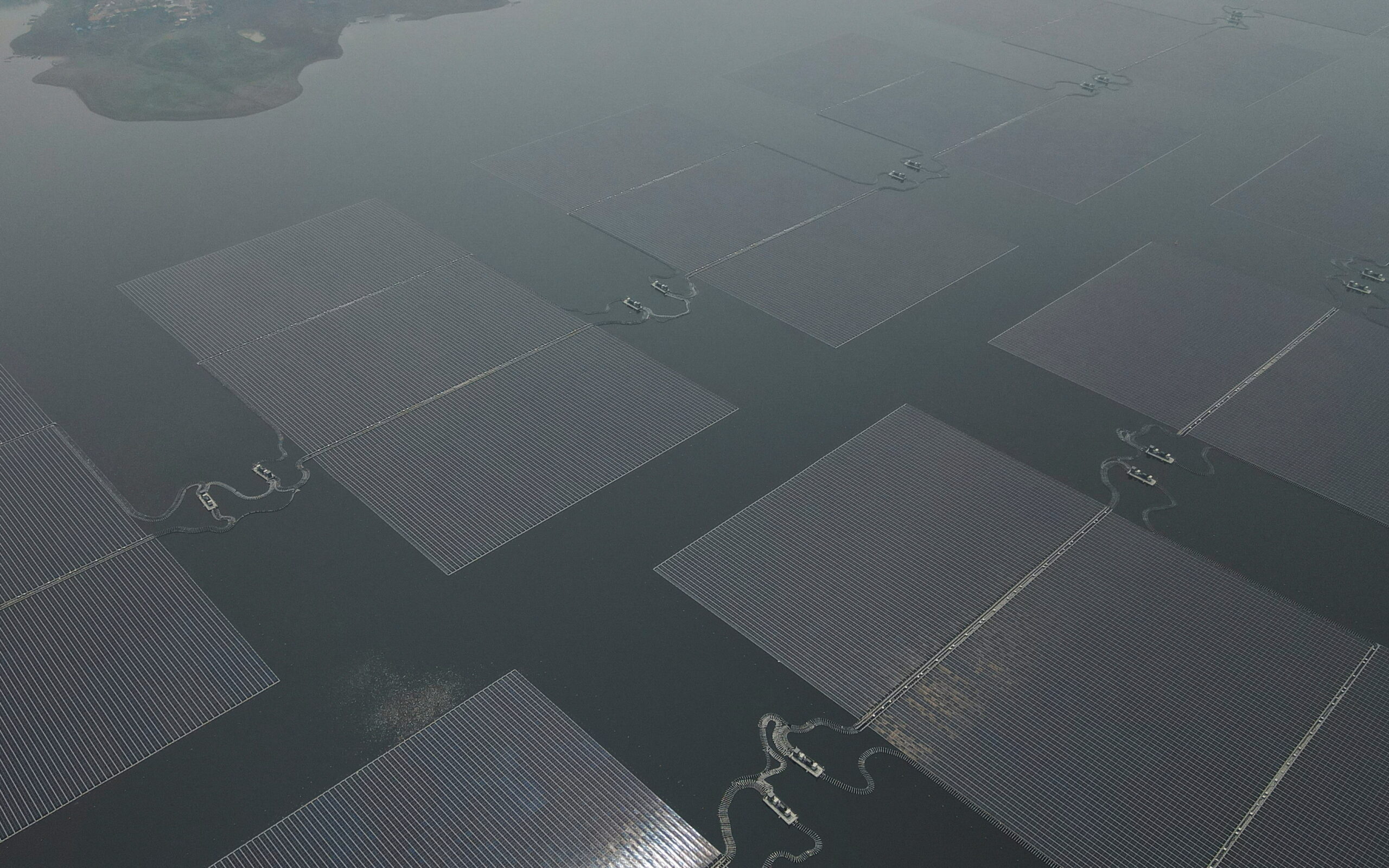 A view shows solar panels of the 192 megawatt peak floating solar power plant built on Cirata dam, developed by PLN Nusantara Power, a unit of Indonesia's state utility company Perusahaan Listrik Negara and United Arab Emirates renewable energy company Masdar, a unit of Mubadala Investment Company, in Purwakarta, West Java province, Indonesia, November 9, 2023. (REUTERS/Willy Kurniawan)