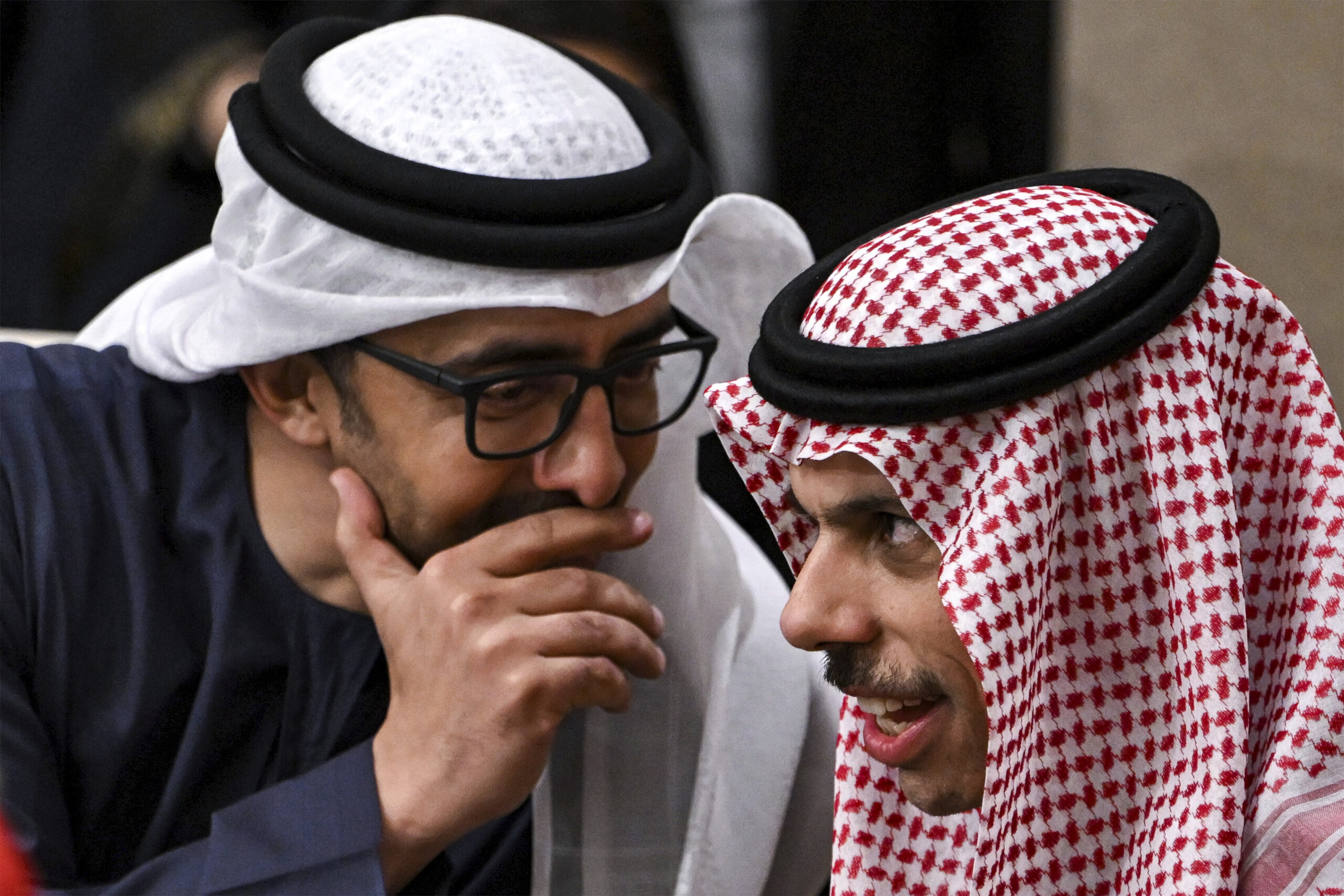 Then Emirati Foreign Minister Sheikh Abdullah bin Zayed al-Nahyan, left, speaks with Saudi Foreign Minister Prince Faisal bin Farhan during a meeting with the foreign ministers of the Arab Contact Group on Syria in Aqaba, Jordan, December 14, 2024. (Andrew Caballero-Reynolds/Pool via AP)