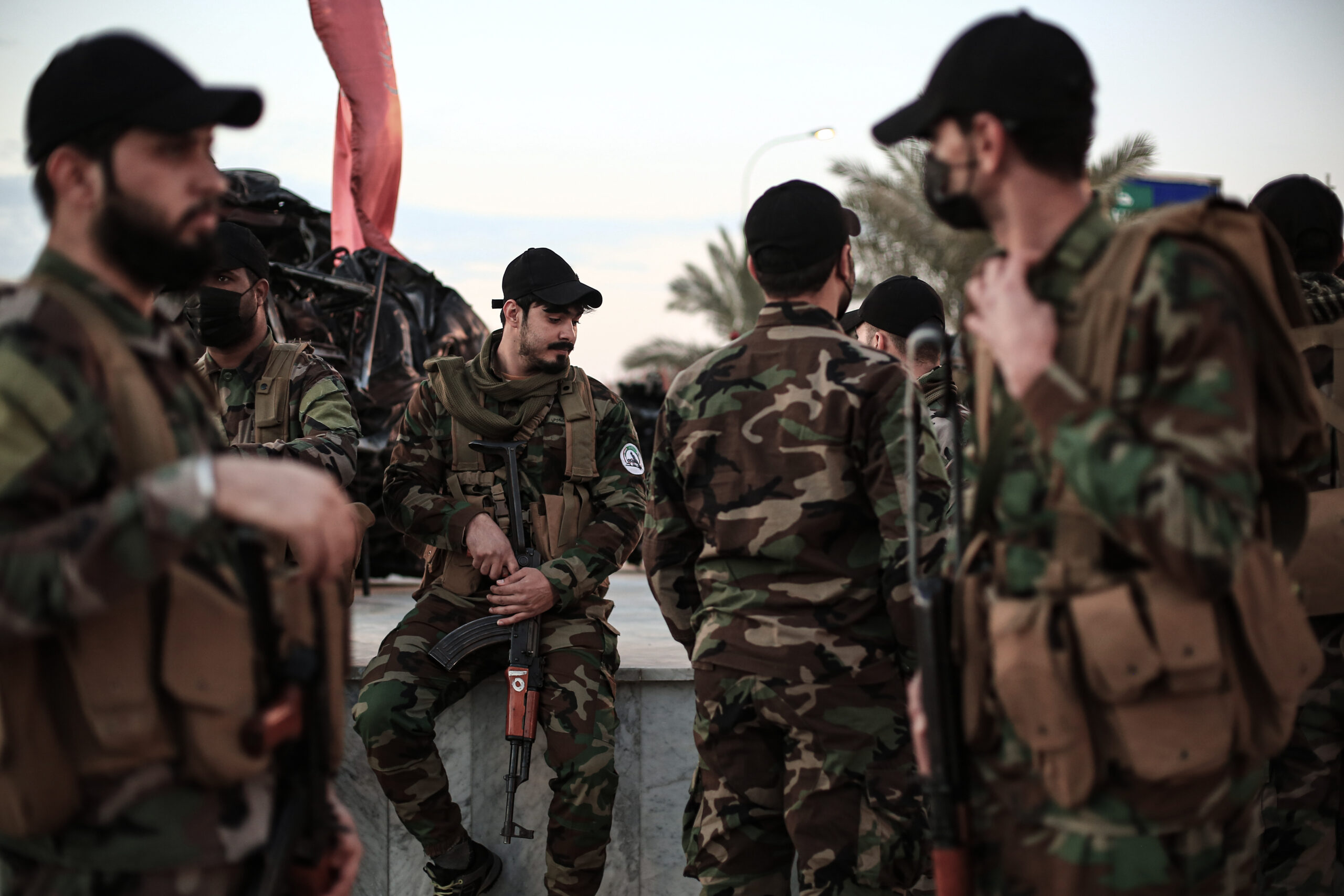 Members of Iraq's Popular Mobilization Forces attend a commemoration ceremony marking the second anniversary of the killing of Iranian military commander and head of the Quds Forces Major General Qassim Suleimani and Iraqi militia commander Abu Mahdi al-Muhandis near Baghdad International Airport, January 2, 2022. (DPA/PICTURE ALLIANCE)