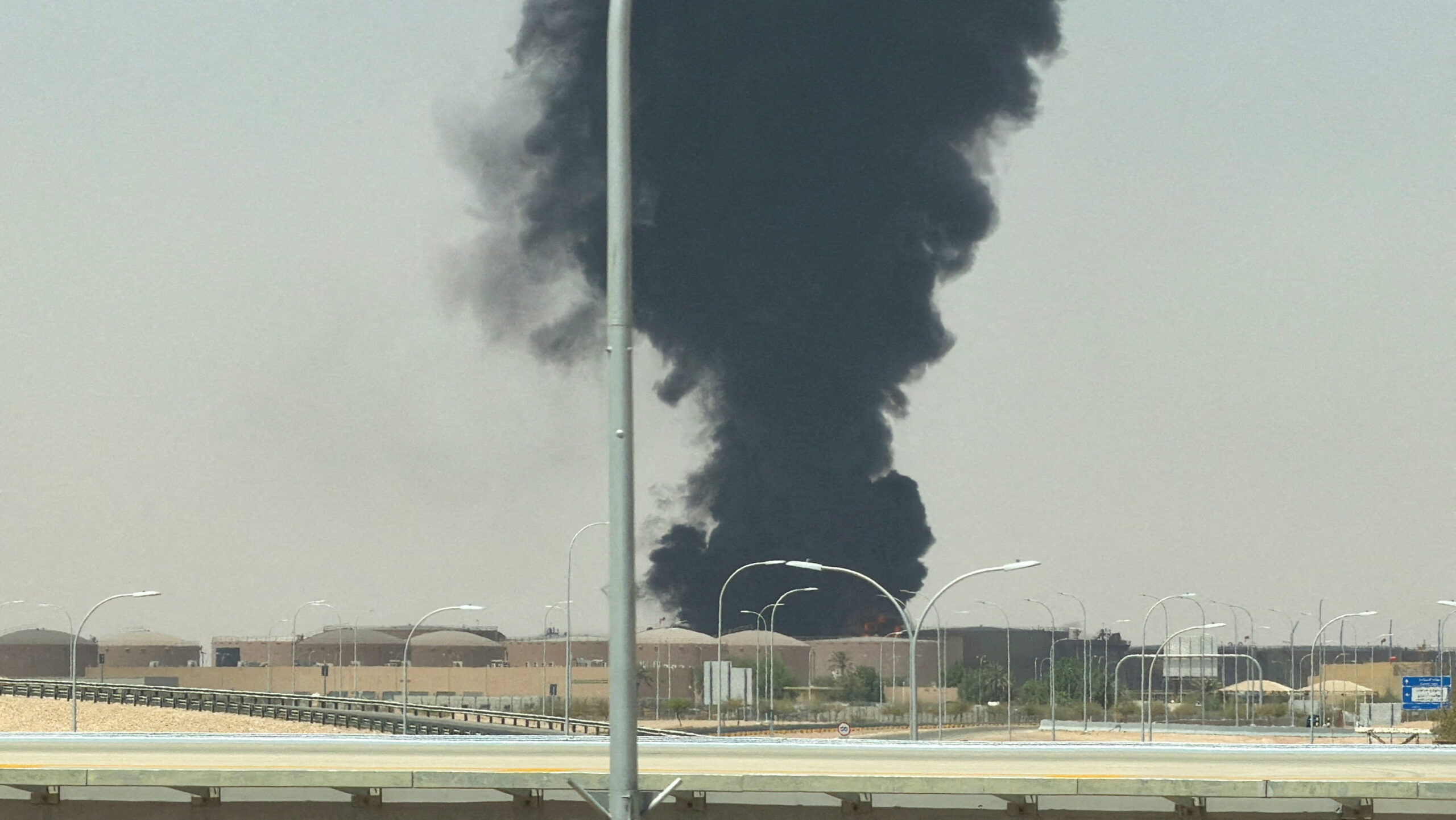 Large plume of black smoke rises from the fuel storage area at King Khalid International Airport, in Riyadh, Saudi Arabia, September 19. (REUTERS/Stringer)